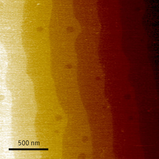 In situ AFM measurements of SrTiO3 and Co particles inside an electron microscope made with cryogenic scanning probe microscope attoAFM III